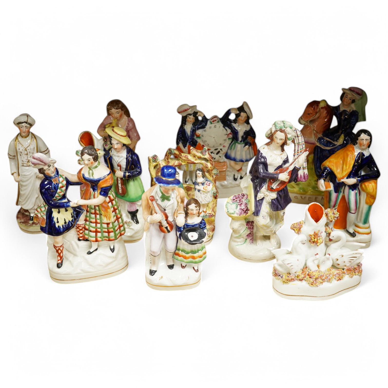 Eleven various Staffordshire figures, tallest 23cm. Condition - varies